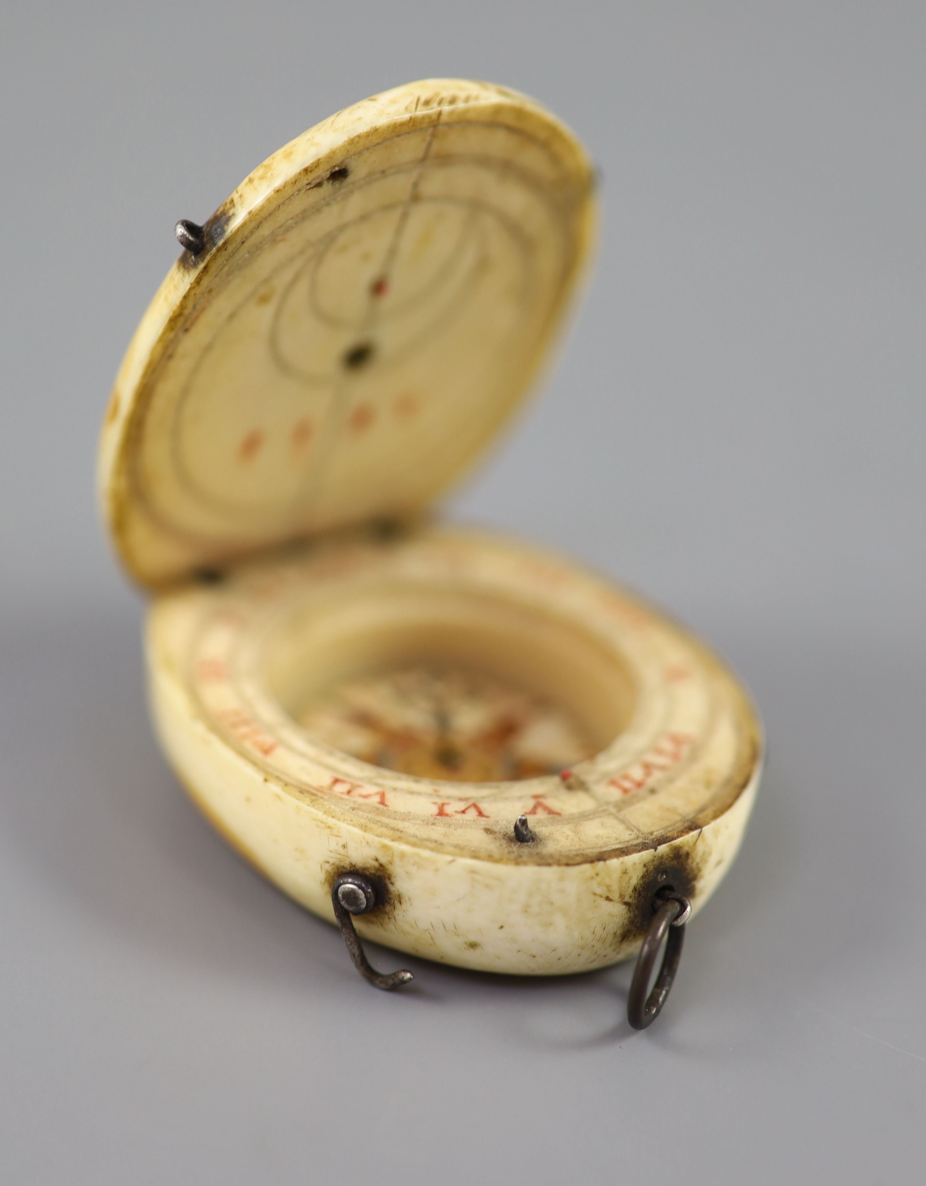 A rare late 16th century German oval ivory diptych-dial, width 39mm depth 48mm length 48mm